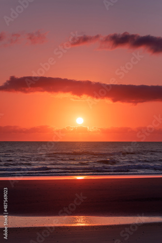 Gold coast beach colourful orange sky with clouds at sunrise