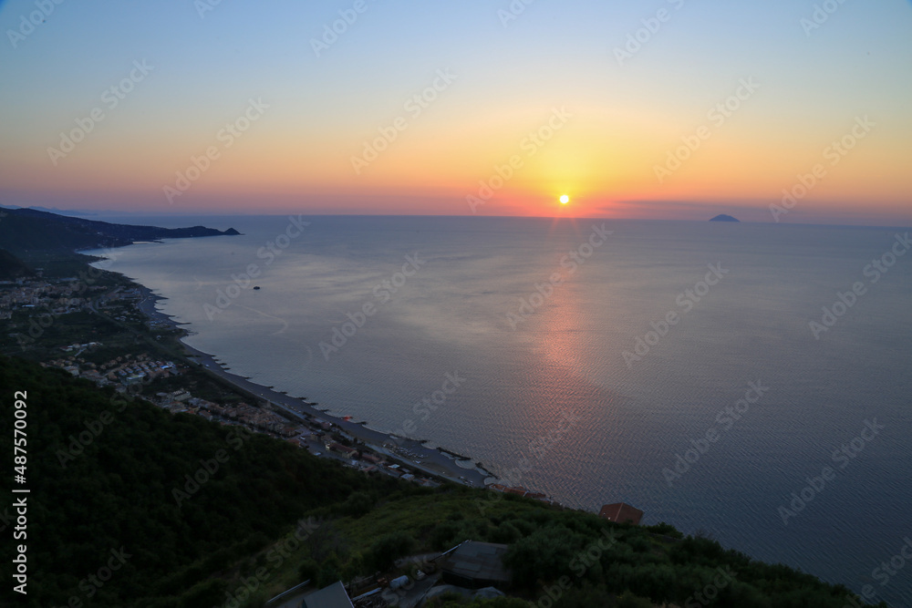 Sunset over the Mediterranean sea with clear sky. Sun over the water