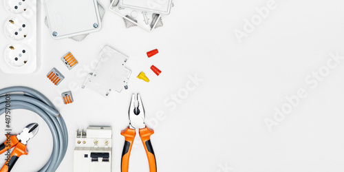 electric tools and electrical equipment on white background with copy space. banner.