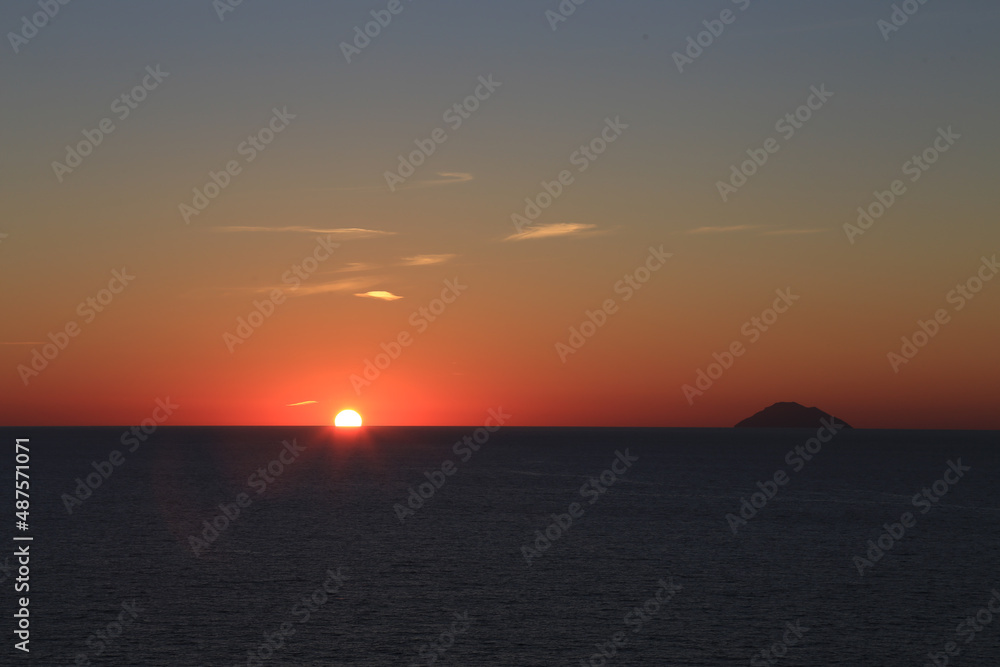 Sunset over the Mediterranean sea with clear sky. Sun over the water