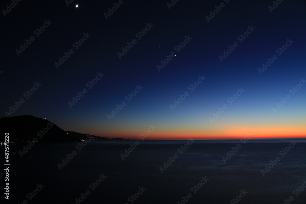 Sunset over the Mediterranean sea with clear sky. Sun over the water Sunset over the Mediterranean sea with clear sky. Sun over the water