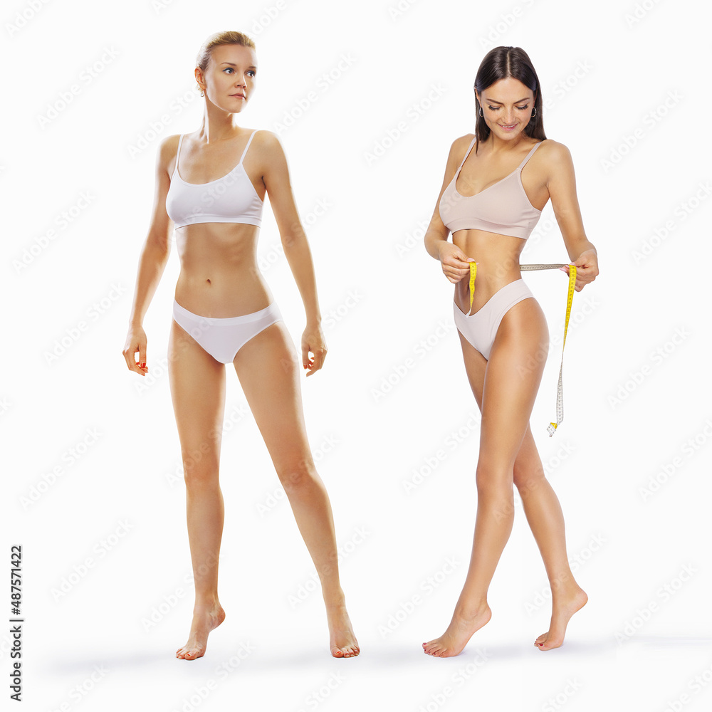 Flat stomach with measuring tape. Measuring a woman's waist with a measuring tape. Flat stomach with measuring tape. Measuring a woman's waist with a measuring tape.