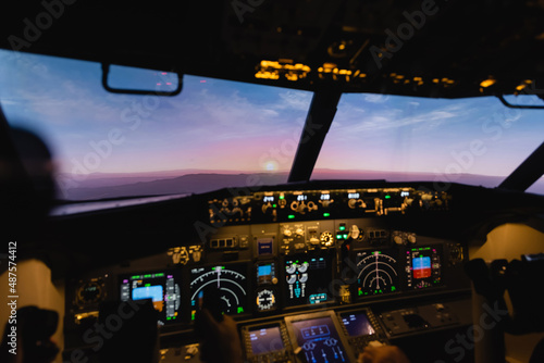 blue and pink sky during sunset through cockpit windows.