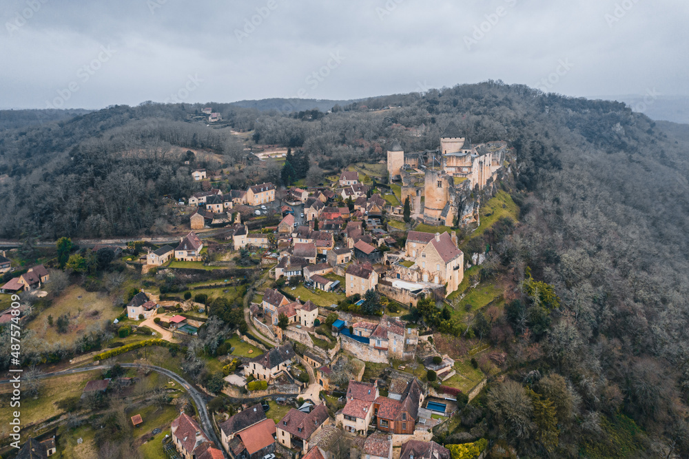 Aerial view of an ancient medieval French village and Castelnaud-la-Chapelle Castle on the mountain in France