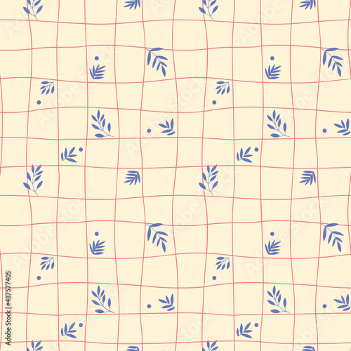 motif au rapport de fleurs et feuilles monochrome par dessus une trame ondulée formant des carreaux