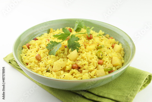 indian breakfast dish poha Aloo/Kanda Poha or Tarri Pohe with spicy chana masala/curry photo