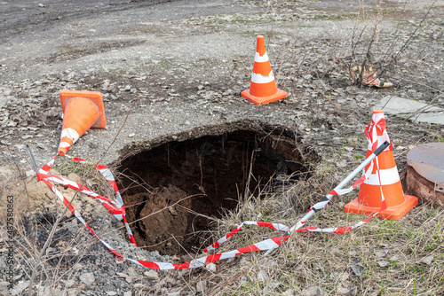Wallpaper Mural Sinkhole due to the pipe break of a main heater supply line fenced with traffic cones in the city Torontodigital.ca