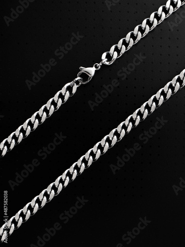 Men's silver chain on a black background