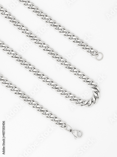 Men's silver chain on a white background with standard links