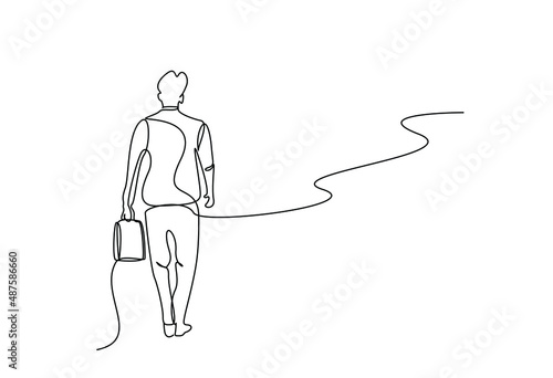 businessman walking on the road with bag in hand