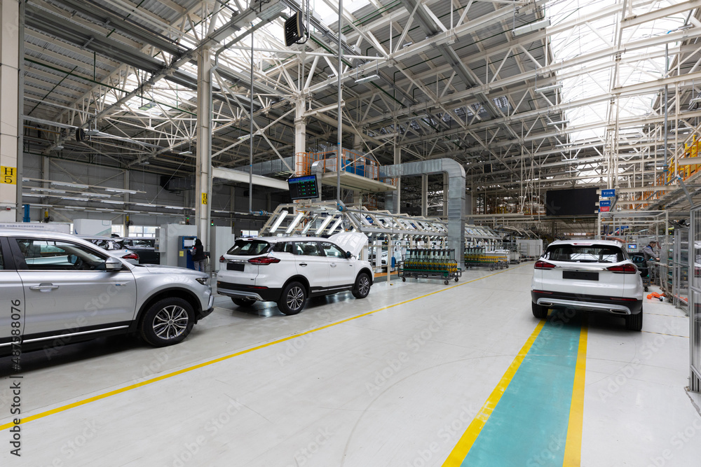 Fototapeta premium Automobile production line. Modern car assembly plant. Interior of a high-tech factory, manufacturing