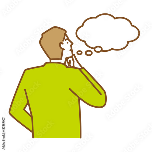 アゴに手をあて何かを想像する若い男性