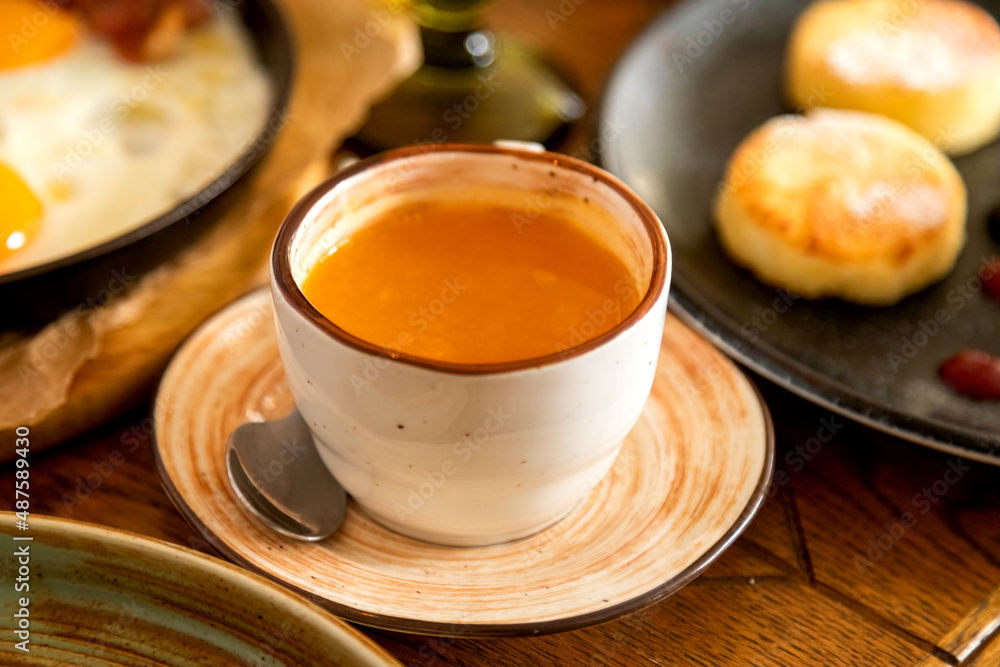 breakfast table with a variety of dishes and drinks breakfast table with a variety of dishes and drinks