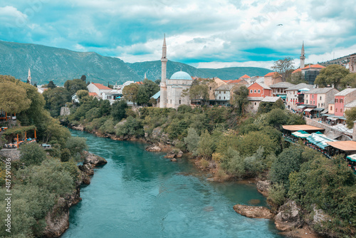 The view of Mostar’s Koski Mehmed Pasha Mosque from the old bridge showing the mosque