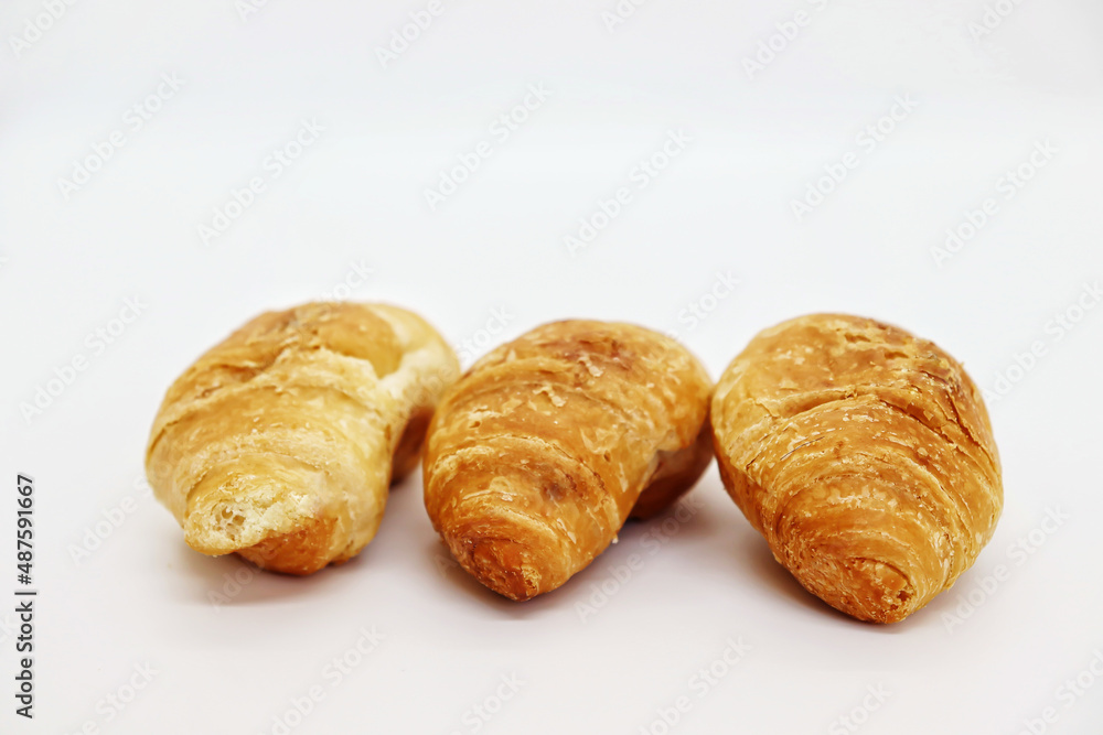 Small croissants on a white table