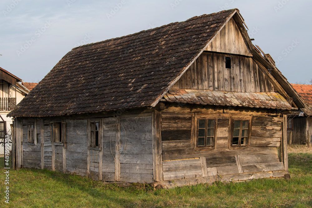 Sunja, Croatia, 05,04,2021: Abandoned traditional old wooden house.
Sunja, Croatia, 05,04,2021: Abandoned traditional old wooden house.