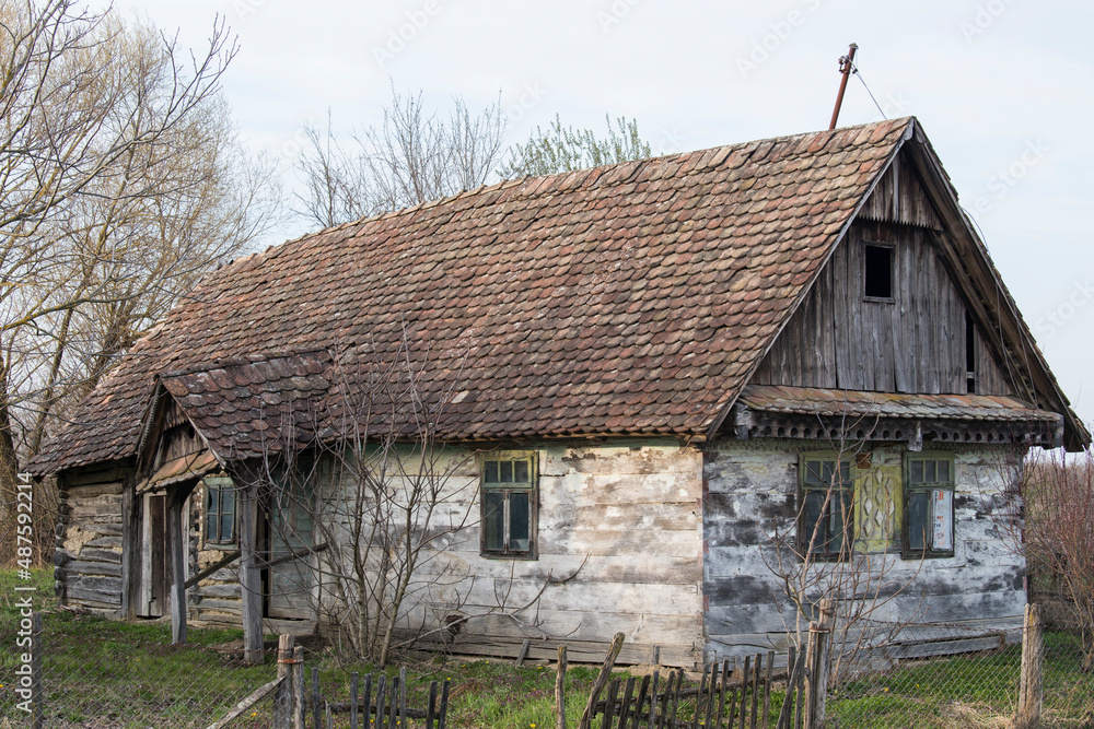 Sunja, Croatia, 05,04,2021: Abandoned traditional old wooden house.
Sunja, Croatia, 05,04,2021: Abandoned traditional old wooden house.