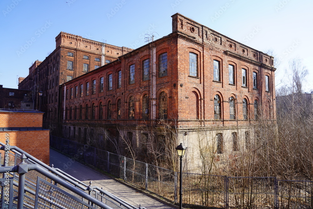 Old red brick factory, old architecture of the city of Lodz, Poland. Abandoned factory 