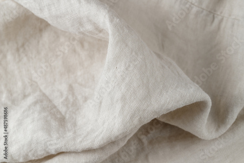 Creased light white grey color natural linen fabric as background