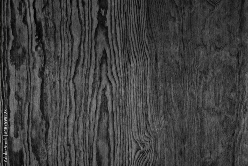 Black wooden pattern texture. Larch plywood. Dark wood background