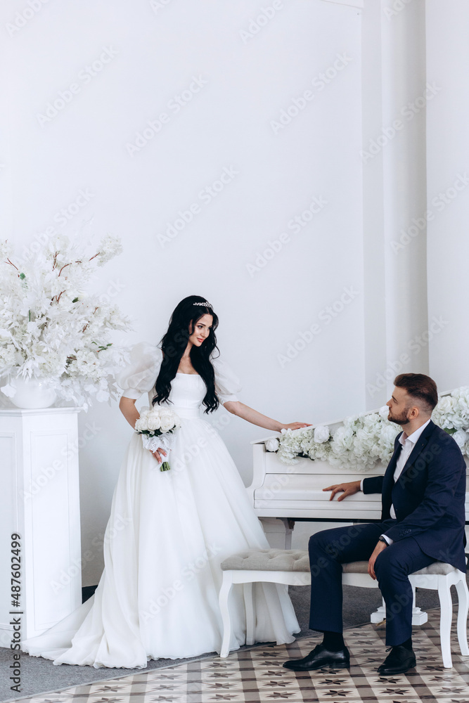 The bride and groom in the ceremony hall. The newlyweds congratulate each other. A significant day.