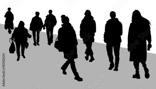 Silhouettes of people. A group of people walk towards each other. The people on the street are walking along the road. Eight people. Vector illustration.