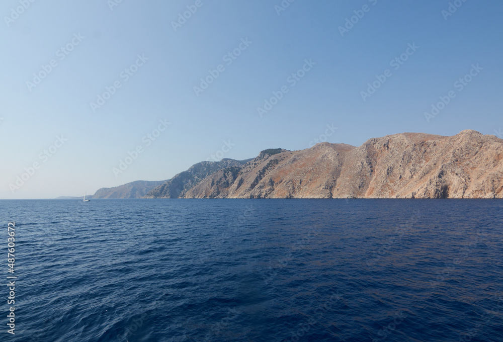 Panorama of the rocky sea coast taken on a boat trip in the Mediterranean