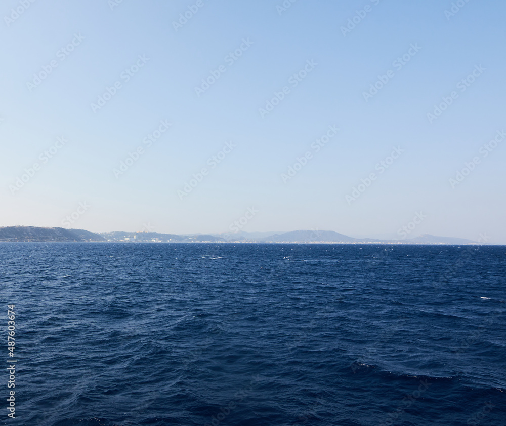 The texture of the blue-blue sea surface with playing durations of light