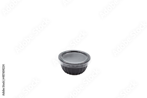 Plastic black bowl with transparent lid on white background
