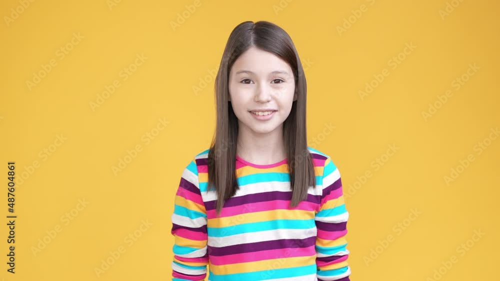 Sweet kid girl cover mouth gossip privacy isolated shine color background Sweet kid girl cover mouth gossip privacy isolated shine color background