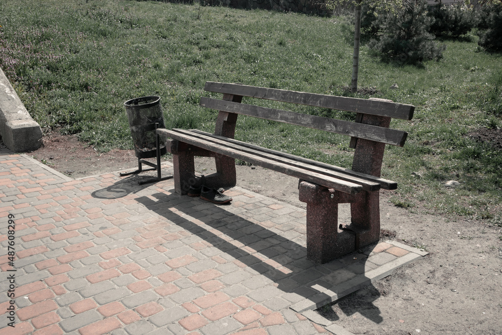 A very old and dirty bench in the park