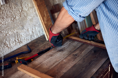 Wallpaper Mural Man assembling furniture and fixing it - hobby concept. Torontodigital.ca