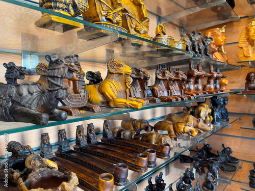 Figurines of sphinx with ram's head and Pharaohs in souvenir shop in Hurghada, as travel concept. Souvenirs from Egypt
