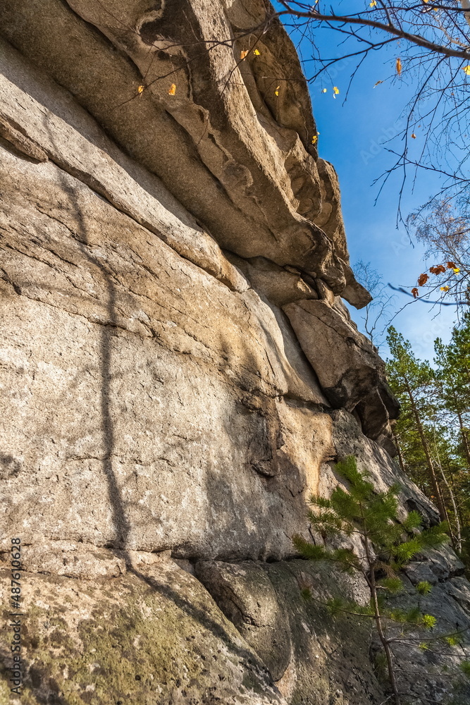 Autumn landscape with trees and rocks on top of a mountain against the sky Autumn landscape with trees and rocks on top of a mountain against the sky