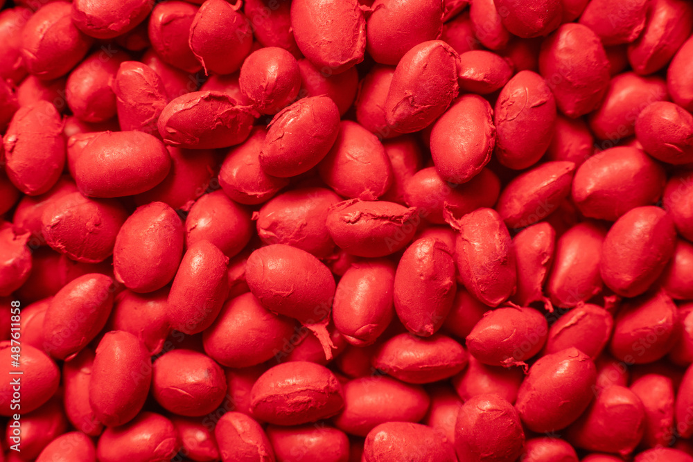 Red polymer dye in granules, background texture Red polymer dye in granules, background texture