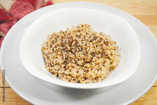 A Side Dish of Steamed Quinoa and Brown Rice in a White Bowl