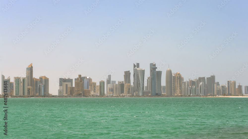 City skyline of Doha from the sea on a hot day, Qatar