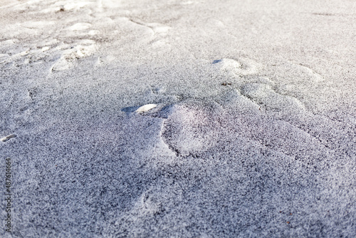 Foto Black soot from the boiler room on white snow