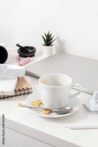 Wallpaper Mural Messy table with laptop, dirty cups, and stationary items. Cluttered workplace, desk. Concept of being overwhelmed by working or studying. Mess and chaos at home. Deadline, stress. Torontodigital.ca