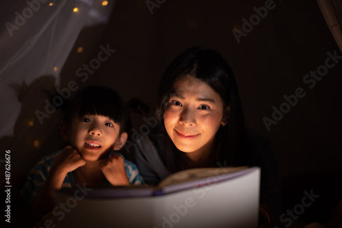 education learning concept with homework, young woman teaching to daughter at home