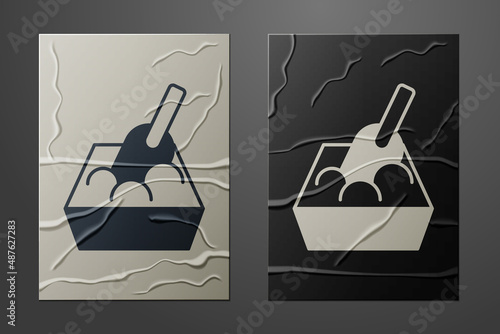 White Cat litter tray with shovel icon isolated on crumpled paper background. Sandbox cat with shovel. Paper art style. Vector