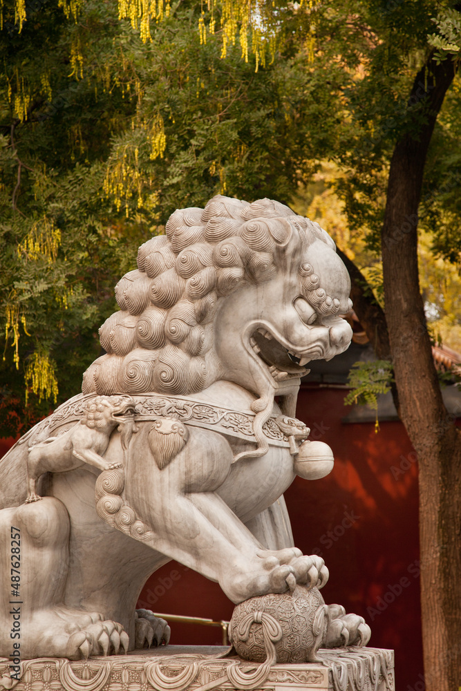 Marble sculpture of male lion, one of traditional guardian pair at Jingshan Park gate. Beijing, China
