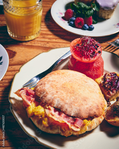 tasty egg and bacon brunch sandwich pita with tomato