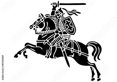 Vytis Lithuania symbol an armored rider on a horse, holding sword raised above his head in his right hand. Shield with a double cross hangs next to the rider's left shoulder. Golden color, rider horse photo