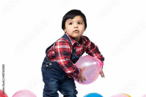 Happy Asian Indian Toddler Boy Playing With Balloons. Fun, Activity, Pre School, Educational, Kindergarten, Birthday, Learning, Home Activity, School, Nursery, Daycare, Play, Physical Activity Concept