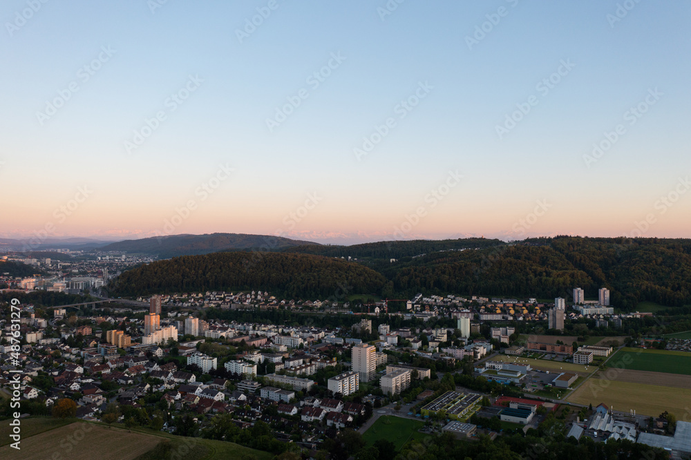 Amazing shot of a beautiful landscape in the alps of Switzerland. Wonderful flight with a drone over an amazing landscape in the canton of Aargau. Epic view at sunset over a village called Nussbaumen. Amazing shot of a beautiful landscape in the alps of Switzerland. Wonderful flight with a drone over an amazing landscape in the canton of Aargau. Epic view at sunset over a village called Nussbaumen.