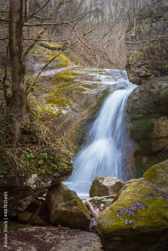 Fototapeta premium Natural riverbed and waterfalls on a mountain river, autumn in a natural park, walking in picturesque places..-.