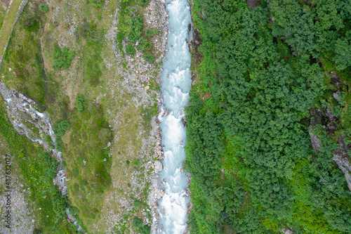 Amazing shot of a beautiful landscape in the alps of Switzerland. Wonderful flight with a drone over an amazing landscape in the canton of Bern. Epic view over a river.