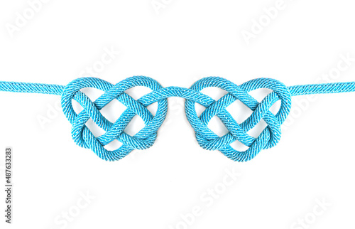 Blue heart shaped celtic knots isolated on white