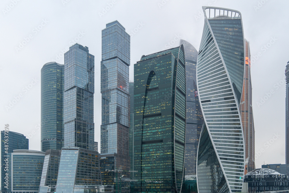 Skyscrapers in the center of Moscow on a cloudy day. High-rise buildings in the capital of the Russia. Complex Moscow-city against the gray sky.